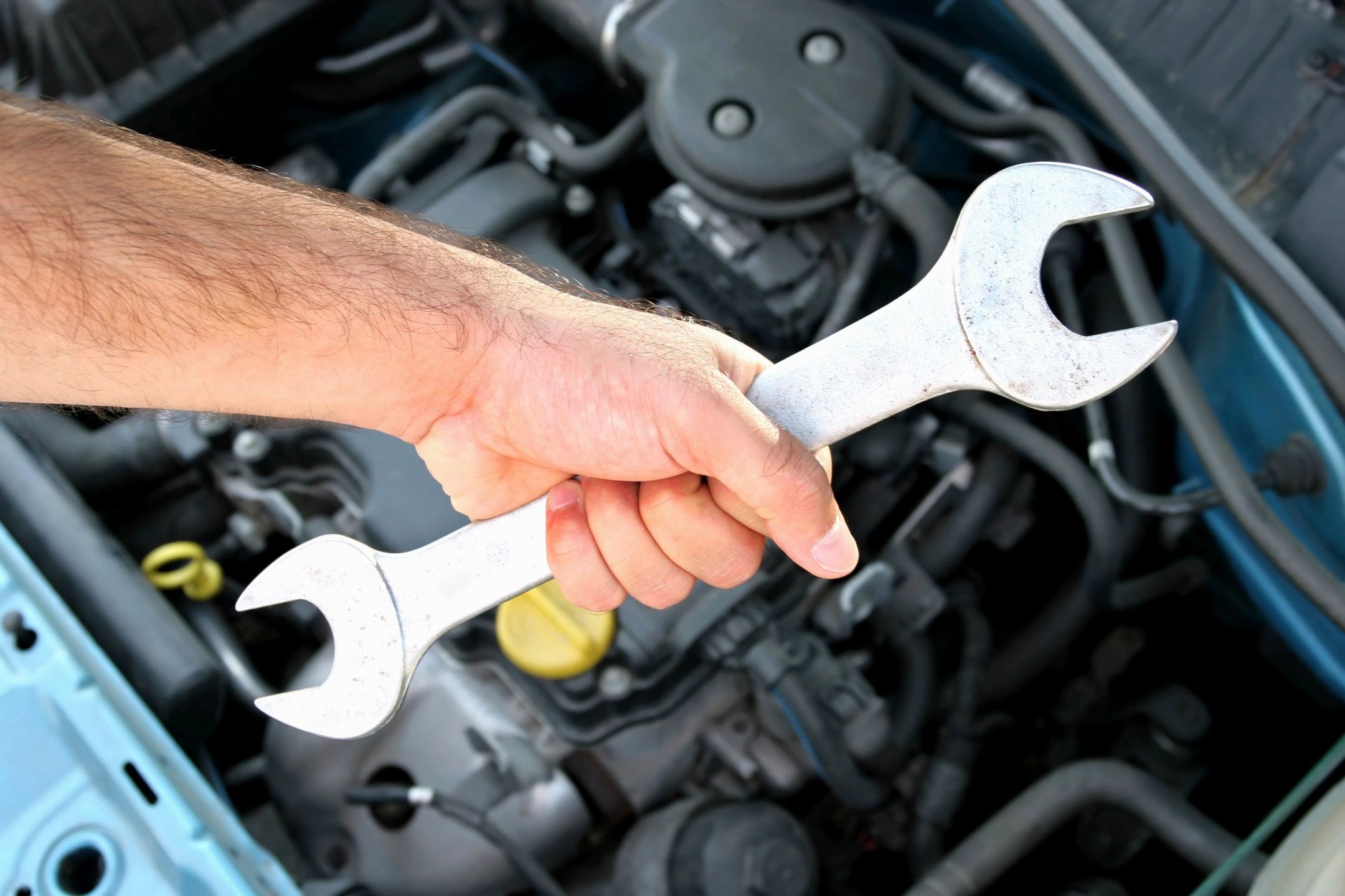 Mechanic working in the Action Automotive service bay in Loveland
